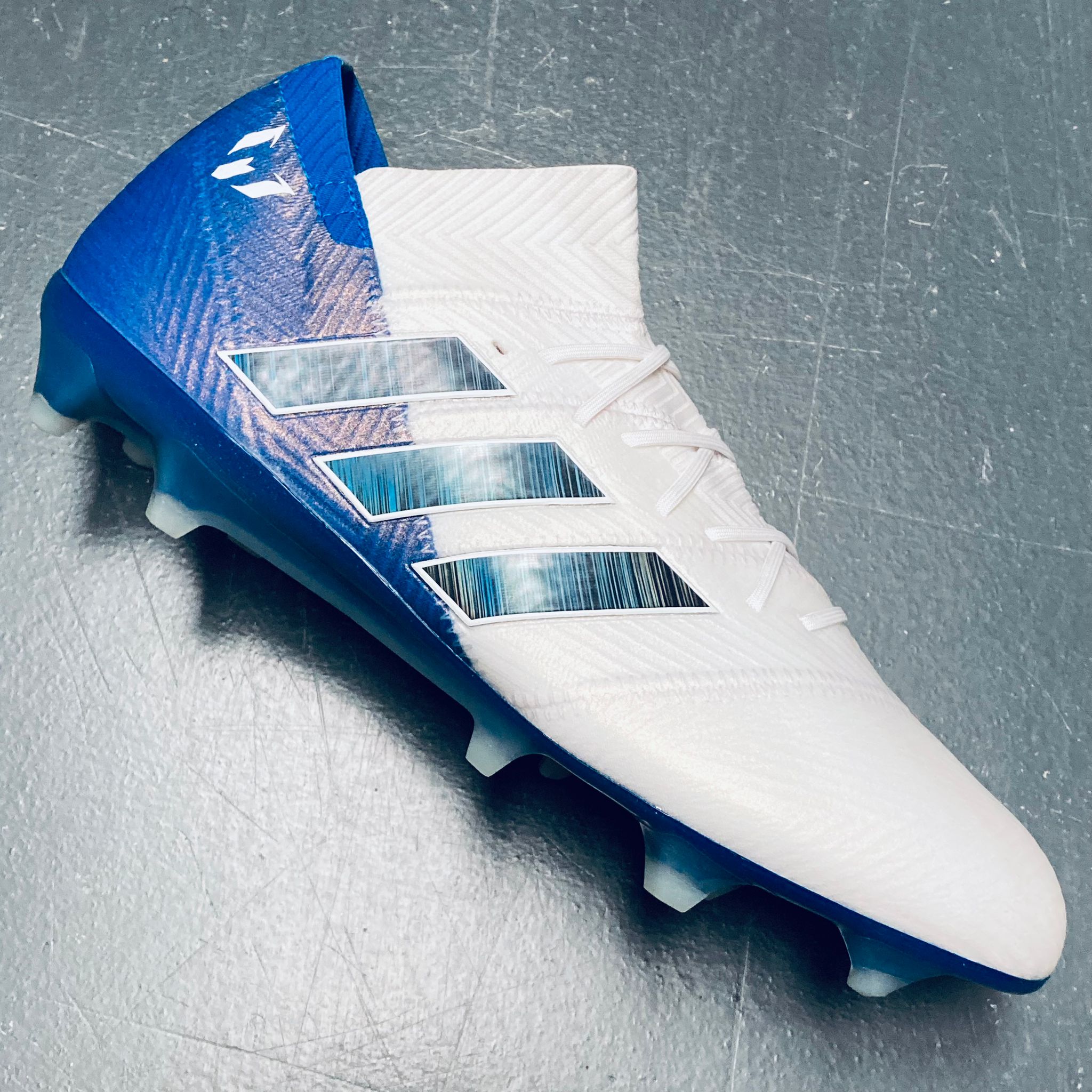 Blue and shop white messi boots